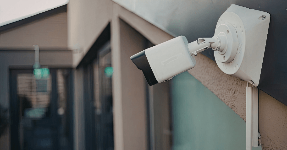Outdoor security camera installed to monitor a building entrance 