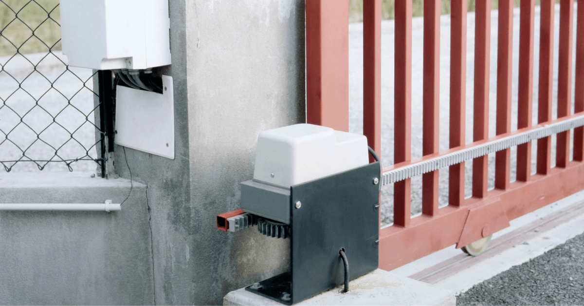 Close-up of a sliding gate and its motor 