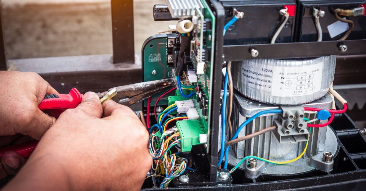electric gate installer setting up a new gate motor