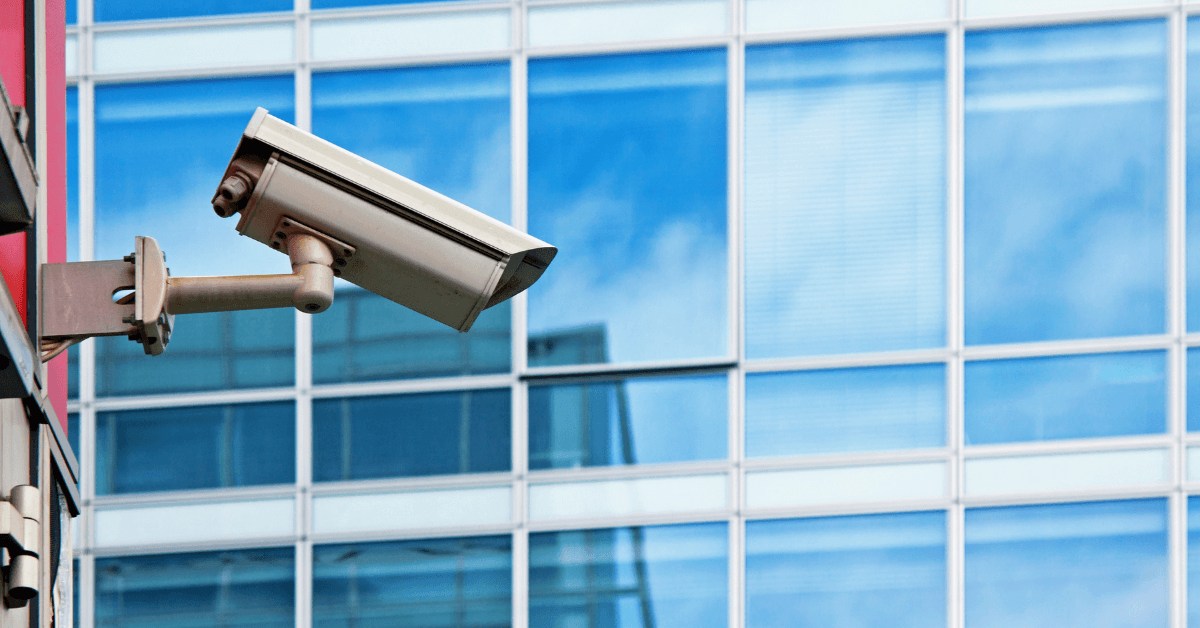 Security camera installed on the outside of a modern commercial building 