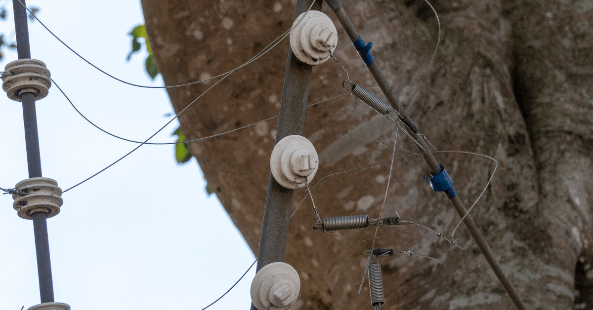 Close-up of a broken electric security fence
